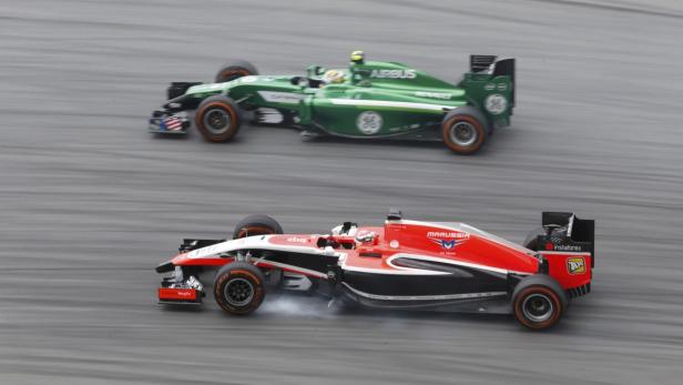 Marussia Formula One driver Bianchi passes Caterha