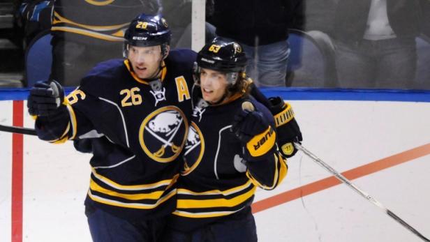 Buffalo Sabres left wing Thomas Vanek (26) and center Tyler Ennis (63) celebrate a goal against the Montreal Canadiens during the third period of their NHL hockey game in Buffalo, New York February 7, 2013. REUTERS/Doug Benz (UNITED STATES - Tags: SPORT ICE HOCKEY)