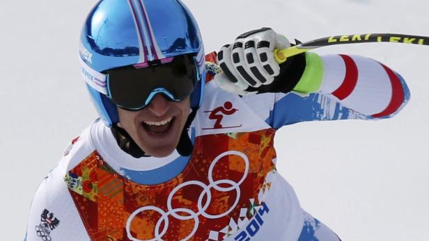 Austria's Mayer reacts in the fininsh area after c