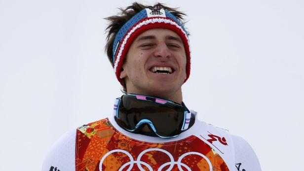 Winner Austria's Mayer reacts on podium after the