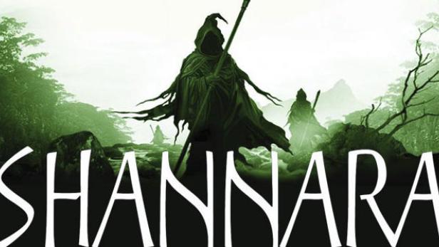 Das Cover von „Shannara“ zeigt eine düstere Gestalt mit Stab in einer grünen Landschaft.
