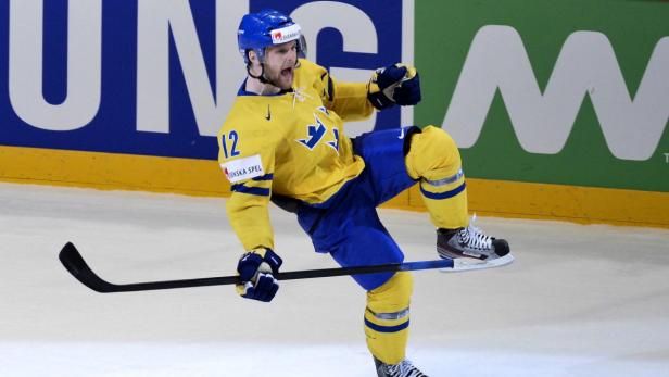 epa03704010 Sweden&#039;s Fredrik Pettersson jubilates after scoring the winning goal in the penalty shootout during the 2013 Ice Hockey IIHF World Championships quarter final match between Canada and Sweden in Stockholm, Sweden, 16 May 2013. EPA/ANDERS WIKLUND SWEDEN OUT