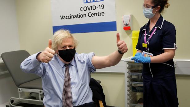 British Prime Minister Boris Johnson receives a dose of the Oxford/AstraZeneca COVID-19 vaccine in London