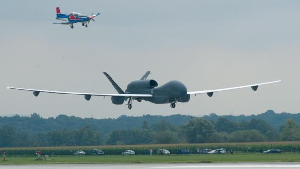 epa02834616 An unmanned aerial vehicle (UAV), Euro Hawk, come into land after a non-stop-flight from California at the German Air Force Manching air base in Manching, Germany, 21 July 2011. Reports state that the Northrop Grumman RQ-4 Global Hawk derivative, Euro Hawk, will be placed into an extensive period of evaluation with the German militaryís WTD-61 test organisation. The high-altitude, long-endurance type is due to replace the German air forceís retired Dassault/Breguet Altantic surveillance aircraft from around the middle of this decade. EPA/ARMIN WEIGEL