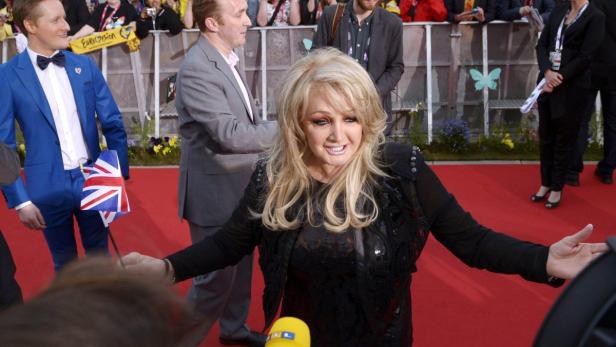 Britain&#039;s Bonnie Tyler, who shall compete with the song &quot;believe in me&quot;, gestures on the red carpet during the opening party for the Eurovision Song Contest at the Opera Hall in Malmo May 12, 2013 in this picture provided by Scanpix Sweden. The Eurovision Song Contest starts with the first semi-final on Tuesday. REUTERS/Janerik Henriksson/Scanpix Sweden (SWEDEN - Tags: ENTERTAINMENT) ATTENTION EDITORS - THIS IMAGE WAS PROVIDED BY A THIRD PARTY. THIS PICTURE IS DISTRIBUTED EXACTLY AS RECEIVED BY REUTERS, AS A SERVICE TO CLIENTS. SWEDEN OUT. NO COMMERCIAL OR EDITORIAL SALES IN SWEDEN. NO COMMERCIAL SALES