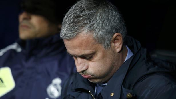 Real Madrid's coach Jose Mourinho concentrates bef Real Madrid's coach Jose Mourinho concentrates before the start of their Spanish King's Cup final soccer match against Atletico Madrid at Santiago Bernabeu stadium in Madrid May 17, 2013. REUTERS/Juan Medina (SPAIN - Tags: SPORT SOCCER)