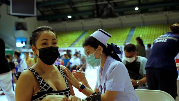 FILE PHOTO: People receive the Sinovac COVID-19 vaccine at the Thai resort island of Phuket