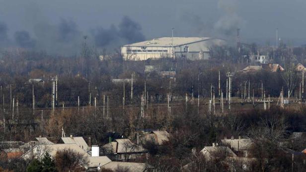 Smoke rises above a servicing hangar of the Sergey
