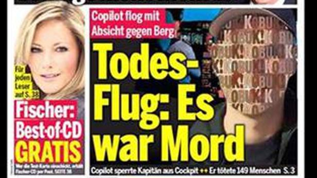 Titelseite einer Zeitung mit einem Artikel über einen Flugzeugabsturz und einem Bild von Helene Fischer.