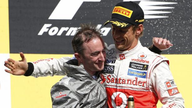 McLaren Formula One driver Jenson Button of Britain celebrates with team engineering director Paddy Lowe (L) after winning the Belgian Grand Prix in Spa Francorchamps September 2, 2012. REUTERS/Francois Lenoir (BELGIUM - Tags: SPORT MOTORSPORT F1)