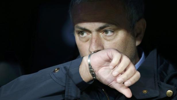 Real Madrid's coach Jose Mourinho concentrates bef Real Madrid's coach Jose Mourinho concentrates before the start of their Spanish King's Cup final soccer match against Atletico Madrid at Santiago Bernabeu stadium in Madrid May 17, 2013. REUTERS/Juan Medina (SPAIN - Tags: SPORT SOCCER)