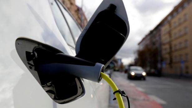 FILE PHOTO: An electric car is charged by a mobile charging station on a street in Prague