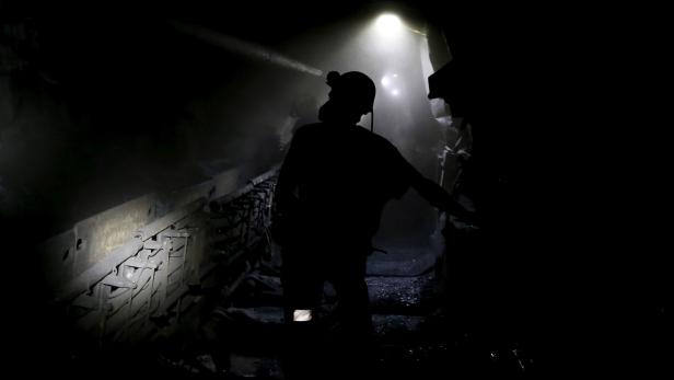 FILE PHOTO: Miners work underground at a coal mine in Silesia