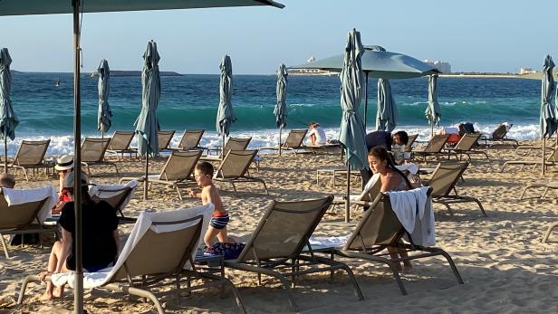 People are seen at the Cove beach Caesars Palace, amid the spread of the coronavirus disease (COVID-19) in Dubai