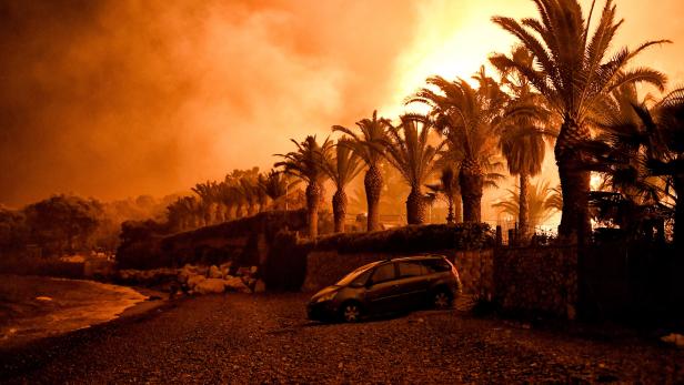 Wildfire raging in a forested area in Schino, Loutraki