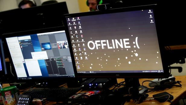 A computer desktop with wallpaper that reads "Offline" is pictured during the Electronic Sports Festival, Austria's largest LAN Party in Vienna