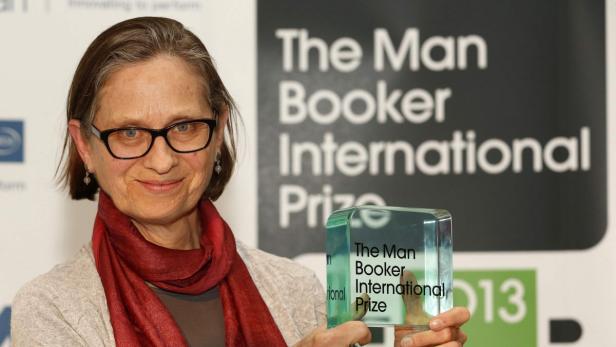 U.S. author Lydia Davis poses after winning the Man Booker Prize at the V&amp;A Museum in London May 22, 2013. American short story writer Davis won the fifth Man Booker International Prize for fiction on Wednesday for a body of work that includes some of the briefest tales ever published. Davis - who has only written one novel - beat a shortlist of 10 contenders for the 60,000 pound ($90,800) prize that included two authors banned in their home countries, the youngest ever nominee and one shortlisted for the second time. REUTERS/Luke MacGregor (BRITAIN - Tags: ENTERTAINMENT PROFILE)