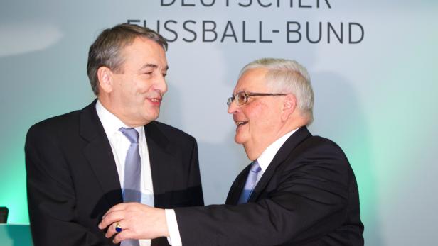 FILE PHOTO: Niersbach, designated DFB president embraces DFB president Zwanziger as they arrive for a general meeting in Frankfurt