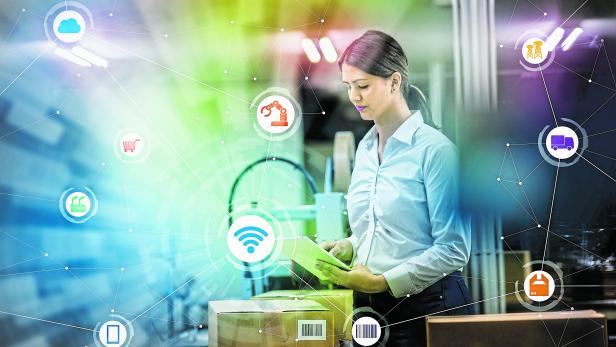 industry and Internet of Things concept. woman working in factory and wireless communication network. Industry4.0.