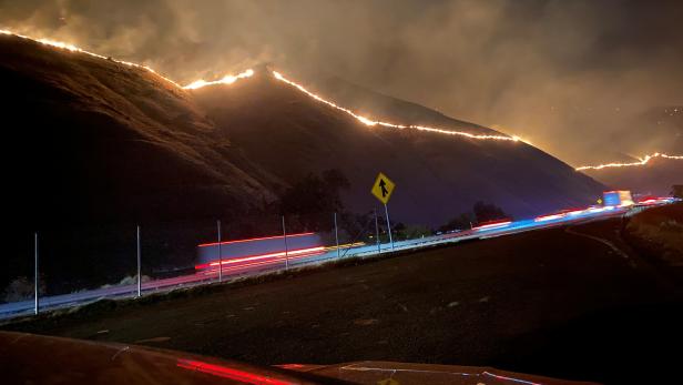 The Shell Fire burns vegetation on a hill along a highway in Kern County, California The Shell Fire burns vegetation on a hill along a highway in Kern County, California