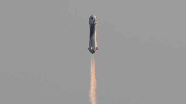 Billionaire businessman Jeff Bezos is launched with three crew members aboard Blue Origin's New Shepard rocket