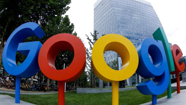 FILE PHOTO: FILE PHOTO: The brand logo of Alphabet Inc's Google is seen outside its office in Beijing