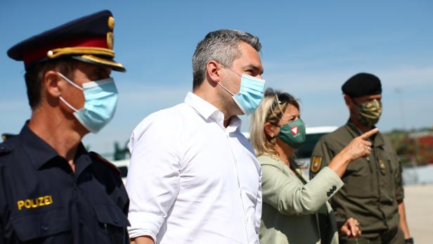 Austrian Interior Minister Karl Nehammer,  and Austrian Defense Minister Klaudia Tanner are seen ahead of an exercise to prevent migrants from crossing the Austrian border from Hungary in Nickelsdorf