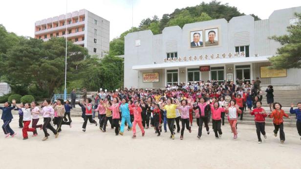 Children run during a visit by North Korean leader Kim Jong-un (not pictured) at the Pyongyang Myohyangsan Children&#039;s Camp, situated at the foot of Mt. Myohyang in North Phyongan Province, in this photo released by North Korea&#039;s Korean Central News Agency (KCNA) on May 20, 2013. REUTERS/KCNA (NORTH KOREA - Tags: EDUCATION SOCIETY POLITICS) ATTENTION EDITORS - THIS PICTURE WAS PROVIDED BY A THIRD PARTY. REUTERS IS UNABLE TO INDEPENDENTLY VERIFY THE AUTHENTICITY, CONTENT, LOCATION OR DATE OF THIS IMAGE. THIS PICTURE IS DISTRIBUTED EXACTLY AS RECEIVED BY REUTERS, AS A SERVICE TO CLIENTS. FOR EDITORIAL USE ONLY. NOT FOR SALE FOR MARKETING OR ADVERTISING CAMPAIGNS. NO THIRD PARTY SALES. NOT FOR USE BY REUTERS THIRD PARTY DISTRIBUTORS
