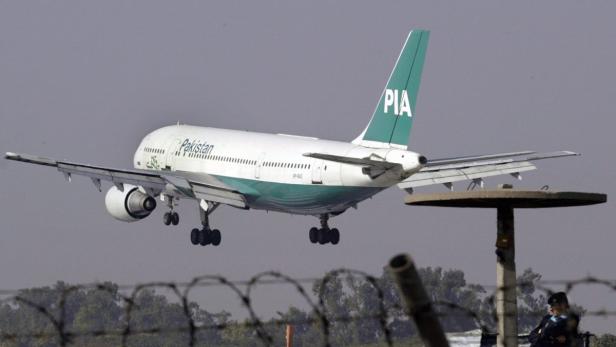 epa03714970 (FILES) A 2nd December 2003 file photo showing a Pakistan International Airlines (PIA) plane arriving at Islamabad airport. Two RAF Typhoon jets escorted a Pakistan International Airlines plane as it was diverted from Manchester to Stansted Airport. A police spokeswoman is reported as saying &#039;an incident has occured on the aircraft&#039;. The plane had flown from Lahore. EPA/OLIVIER MATTHYS