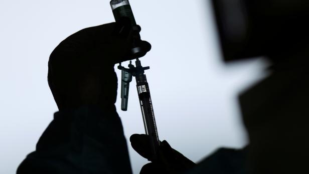 FILE PHOTO: A medical worker prepares a syringe with the AstraZeneca/Oxford COVID-19 vaccine at a vaccination centre in a public hospital in Brasilia