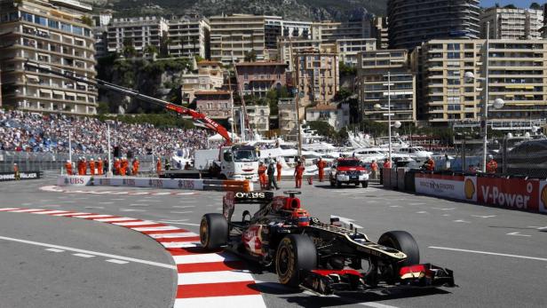 Lotus Renault driver Kimi Raikkonen of Finland steers his car during the first practice session of the Monaco F1 Grand Prix May 23, 2013. REUTERS/Stefano Rellandini (MONACO - Tags: SPORT MOTORSPORT F1)