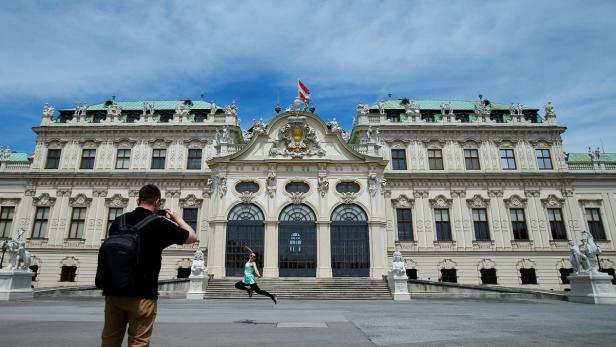 A tourist takes photographs in front of the Belved .