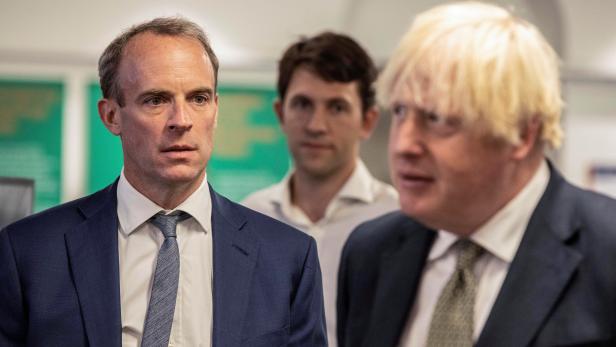 Britain's Prime Minister Boris Johnson and Foreign Secretary Dominic Raab visit FCDO Crisis Centre in London