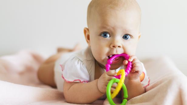 Baby girl with teething ring