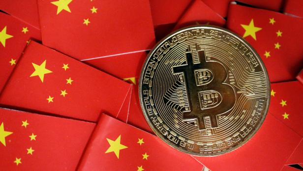 Picture illustration of China's flags and cryptocurrency