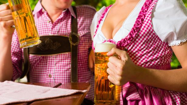 Happy Couple in Beer garden drinking