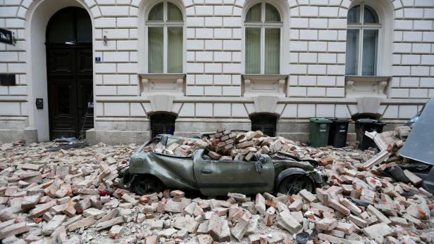 FILE PHOTO: A destroyed car is seen following an earthquake in Zagreb