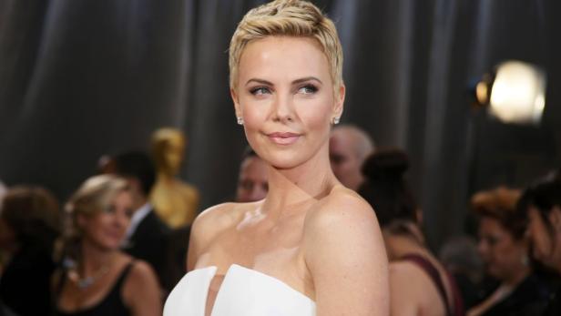 Actress Charlize Theron wearing white Dior Haute C