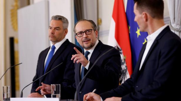 Austrian Chancellor Alexander Schallenberg, Health Minister Wolfgang Mueckstein and Interior Minister Karl Nehammer attend a news conference in Vienna