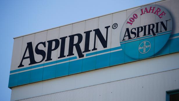 Logo of Bayer is pictured on a billboard for its painkiller Aspirin at the headquarters in Leverkusen