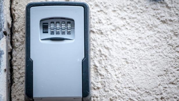 Lockbox, also called keysafe, or key safe, in front of the entrance door of a short term vacation rental, made at delivering keys to guests without contacts.