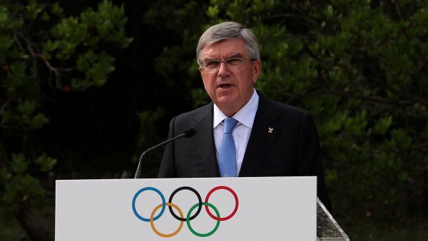 FILE PHOTO: President of the International Olympic Committee (IOC) Thomas Bach delivers a speech at the Pierre de Coubertin monument, where the founder of the IOC's heart is buried, during a ceremony for the 100-year anniversary of the creation of the IOC
