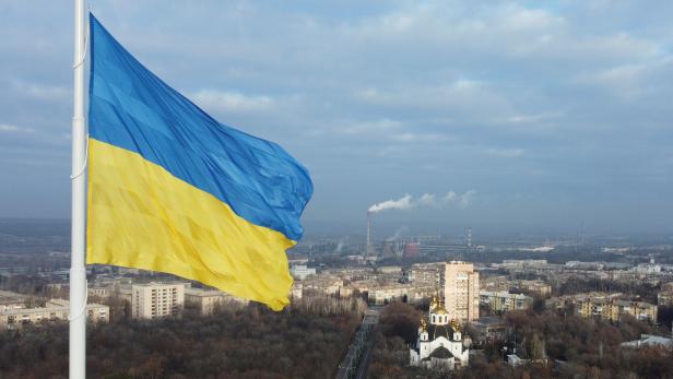 The national flag of Ukraine flies over the town of Kramatorsk