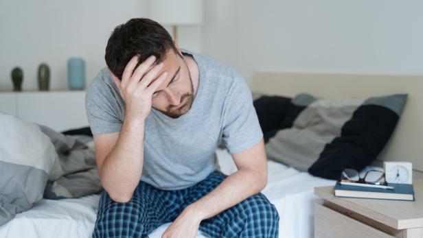 Man with sleeping problem wake up feeling tiredness