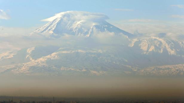 epa03588194 View of the Armenian capital Yerevan and mount Ararat (5137m), Yerevan, Armenia, 17 February 2013. Mount Ararat, located at the border of Turkey, Armenia, and Iran, is a national symbol for Armenians. Presidential elections in Armenia are scheduled for 18 February. EPA/MAXIM SHIPENKOV