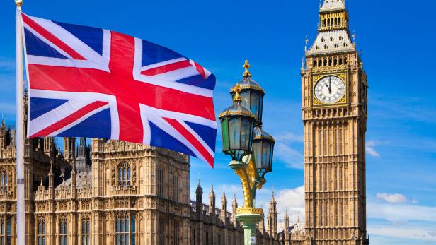 British flag, Big Ben and Houses of Parliament. London