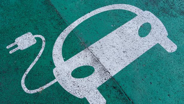 FILE PHOTO: A sign is pictured on an electric car charging station at the United Nations in Geneva