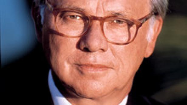 Porträt von Helmut Kohl mit Brille und dunklem Anzug.