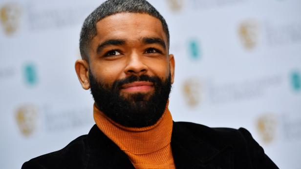 British actor Kingsley Ben-Adir smiles as he celebrates being nominated for the 2021 Rising Star Award in London