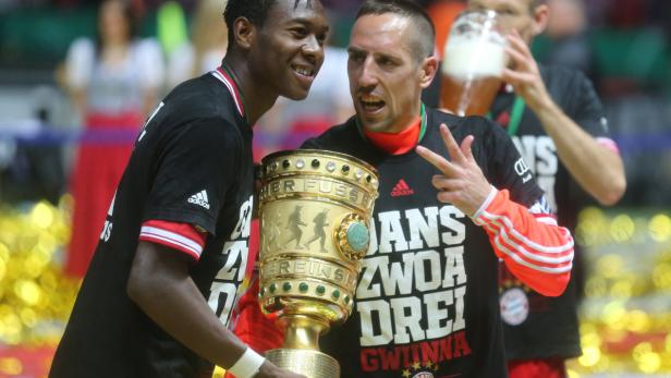 Munich&#039;s Franck Ribery (R) and David Alaba (L) celebrate after winning the German DFB Cup final soccer match between FC Bayern Munich and VfB Stuttgart at the Olympic Stadium in Berlin, Germany, 01 June 2013. Photo: Kay Nietfeld/dpa (ATTENTION: The DFB prohibits the utilisation and publication of sequential pictures on the internet and other online media during the match (including half-time). ATTENTION: BLOCKING PERIOD! The DFB permits the further utilisation and publication of the pictures for mobile services (especially MMS) and for DVB-H and DMB only after the end of the match.) +++(c) dpa - Bildfunk+++
